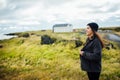 Woman traveler camping and exploring Iceland.Camping equipment and clothing for hikers and extreme weather conditions