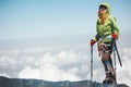 Woman traveler climbing in mountains