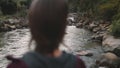 Woman traveler enjoy fast jungle river thailand