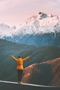 Woman traveler enjoying mountains landscape