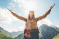 Woman traveler enjoying nature raised hands up to sky Royalty Free Stock Photo