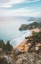 Woman traveler enjoying Tsambika beach view travel summer vacations in Greece Outdoor activity