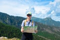 Woman traveler explorer with backpack hiking to the top of the mountain.Shot of a young lost woman holding a map while Royalty Free Stock Photo