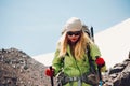 Woman traveler hiking in mountains with backpack Royalty Free Stock Photo