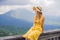 Woman traveler looking at Batur volcano. Indonesia Royalty Free Stock Photo