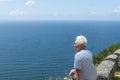 Woman traveler looking at the sea