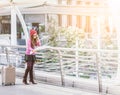 Woman traveler looking at travel map in airport Royalty Free Stock Photo