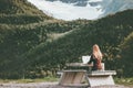 Woman traveler with map planning route trip in Norway sitting at the table Travel Lifestyle concept