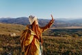 woman traveler mountain top nature travel adventure sunny day Royalty Free Stock Photo