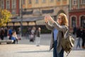 Woman traveler photographing landmark