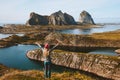 Woman traveler raised hands enjoying islands view travel adventure vacations Royalty Free Stock Photo