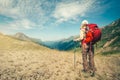 Woman Traveler with red backpack mountaineering Royalty Free Stock Photo