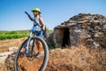 Woman traveler ride bicycle in Hvar, Croatia. Royalty Free Stock Photo