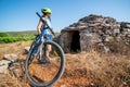 Woman traveler ride bicycle in Hvar, Croatia. Royalty Free Stock Photo