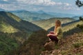 Woman Traveler Sitting Alone on Mountain Rock Royalty Free Stock Photo