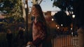 Woman traveler standing railings looking on twilight city close up. Happy girl Royalty Free Stock Photo