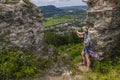Woman traveler takes phone mountain view