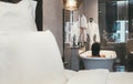 Woman traveler taking a bath in 5-star high-quality hotel bathroom. She lying in the deep white bath tube, relaxing and enjoying Royalty Free Stock Photo