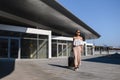 Woman traveler tourist walking with luggage at train station. Active and travel lifestyle concept Royalty Free Stock Photo