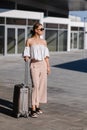 Woman traveler tourist walking with luggage at train station. Active and travel lifestyle concept Royalty Free Stock Photo