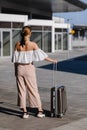 Woman traveler tourist walking with luggage at train station. Active and travel lifestyle concept Royalty Free Stock Photo