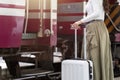 Woman traveler tourist walking with luggage at train station. Active and travel lifestyle concept Royalty Free Stock Photo