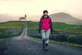 Traveler in Iceland. Church and Lupine Flowers