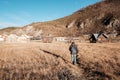 Woman traveler traveling at Napa Lake Grassland, located in Zhongdian city  Shangri-La. landmark and popular spot for tourists Royalty Free Stock Photo