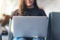 A woman using laptop computer while sitting in the airport Royalty Free Stock Photo