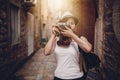 Woman traveler with vintage camera taking photo Royalty Free Stock Photo