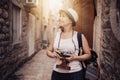 Woman traveler with vintage camera taking photo Royalty Free Stock Photo