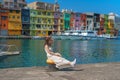 woman traveler visiting in Taiwan, Tourist with hat sightseeing in Keelung, Colorful Zhengbin Fishing Port, landmark and popular