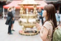 woman traveler visiting in Taiwan, Tourist with hat sightseeing in Longshan Temple, Chinese folk religious temple in Wanhua