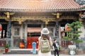 woman traveler visiting in Taiwan, Tourist with hat sightseeing in Longshan Temple, Chinese folk religious temple in Wanhua