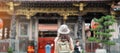 woman traveler visiting in Taiwan, Tourist with hat sightseeing in Longshan Temple, Chinese folk religious temple in Wanhua