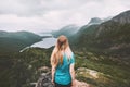 Woman traveling alone in moody mountains