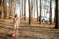 Woman traveling by car in the forest Royalty Free Stock Photo