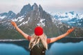 Woman traveling in Norway happy girl raised hands hiking alone outdoor with backpack adventure vacations healthy lifestyle Royalty Free Stock Photo