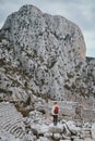 Woman traveling in Turkey tourist sightseeing Termessos ancient city