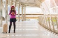 Woman traveller in airport walkway. Travel concept. Royalty Free Stock Photo