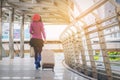 Woman traveller in airport walkway. Travel concept. Royalty Free Stock Photo