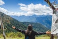 Woman traveller enjoying the picturesque view of Himalayan mountains from Chele la pass