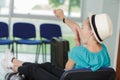 Woman traveller gets bored and waiting at airport