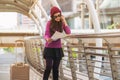 Woman traveller looking at travel map