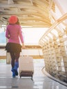 Woman traveller in airport walkway. Travel concept. Royalty Free Stock Photo