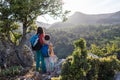 woman travels with a child, A boy and his mother look at the mountains. Hiking and adventures with children