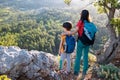 woman travels with a child, A boy and his mother look at the mountains. Hiking and adventures with children