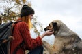 woman travels in the mountains with a dog walk friendship autumn