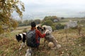 woman travels in the mountains with a dog walk friendship autumn