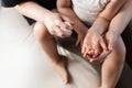 Woman treats a child`s hands from bacteria and viruses. Caring for children`s health. Hand treatment for viruses in the home
